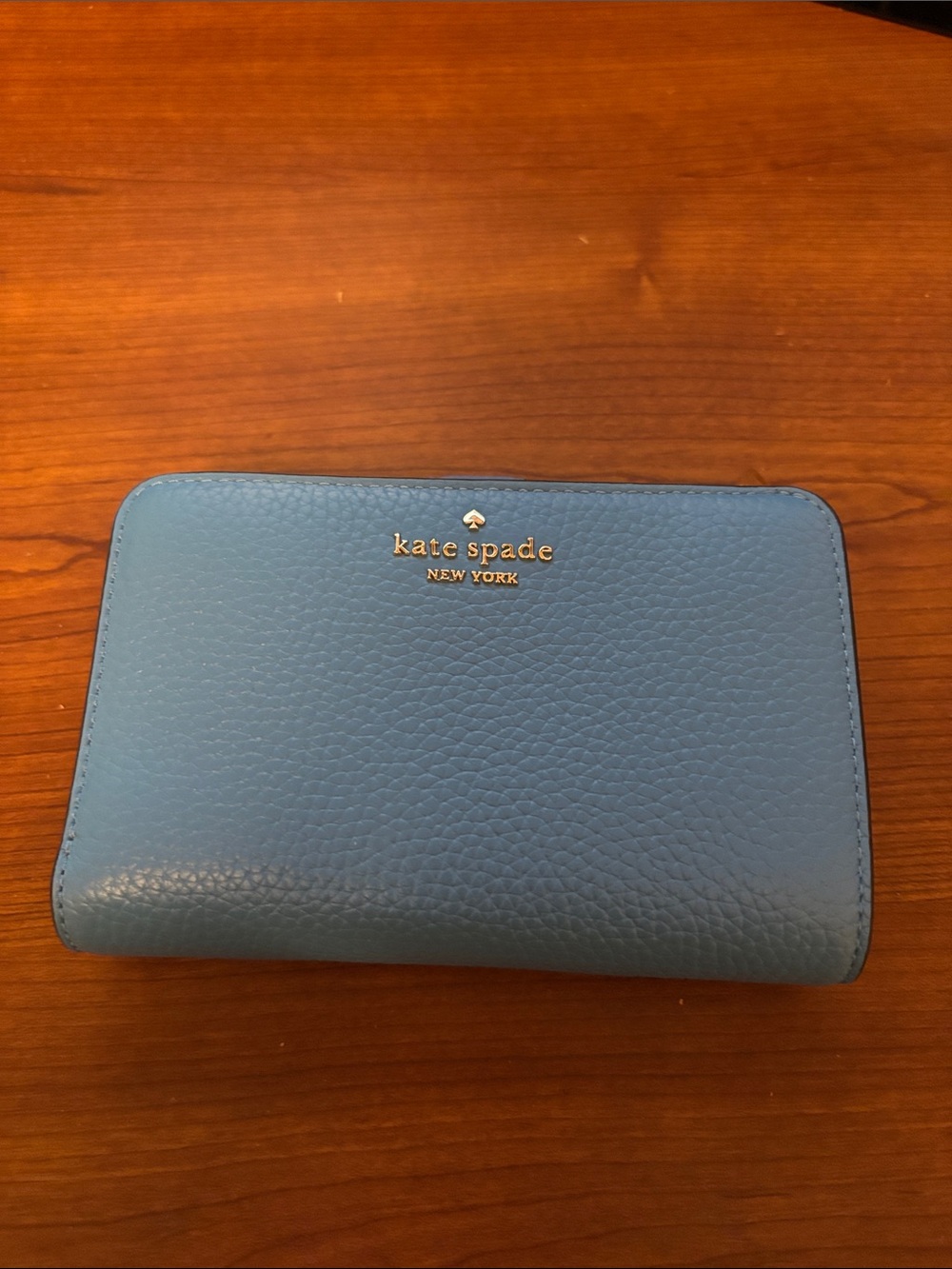 kate spade blue pebbled leather zip-around wallet with gold logo